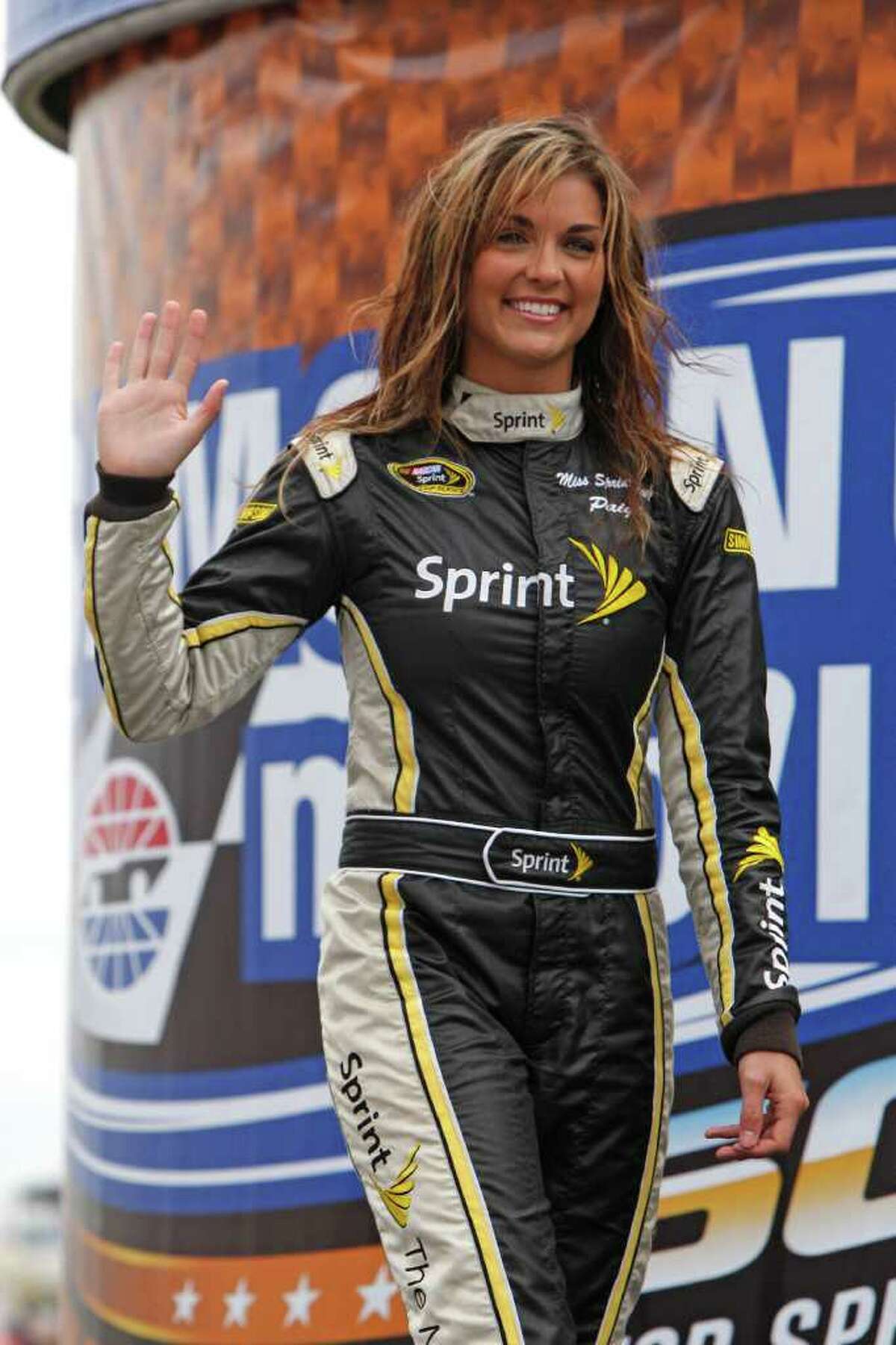 FILE - This April 19, 2010, file photo shows Miss Sprint Cup Paige Duke during driver introductions before the start of the NASCAR Sprint Cup Samsung Mobile 500 auto race at Texas Motor Speedway, in Fort Worth, Texas. NASCAR's Miss Sprint Cup has been let go after nude pictures of her appeared online. Paige Duke told The Charlotte Observer the pictures were taken when she was a freshman at Clemson University and were only meant for her boyfriend at the time.