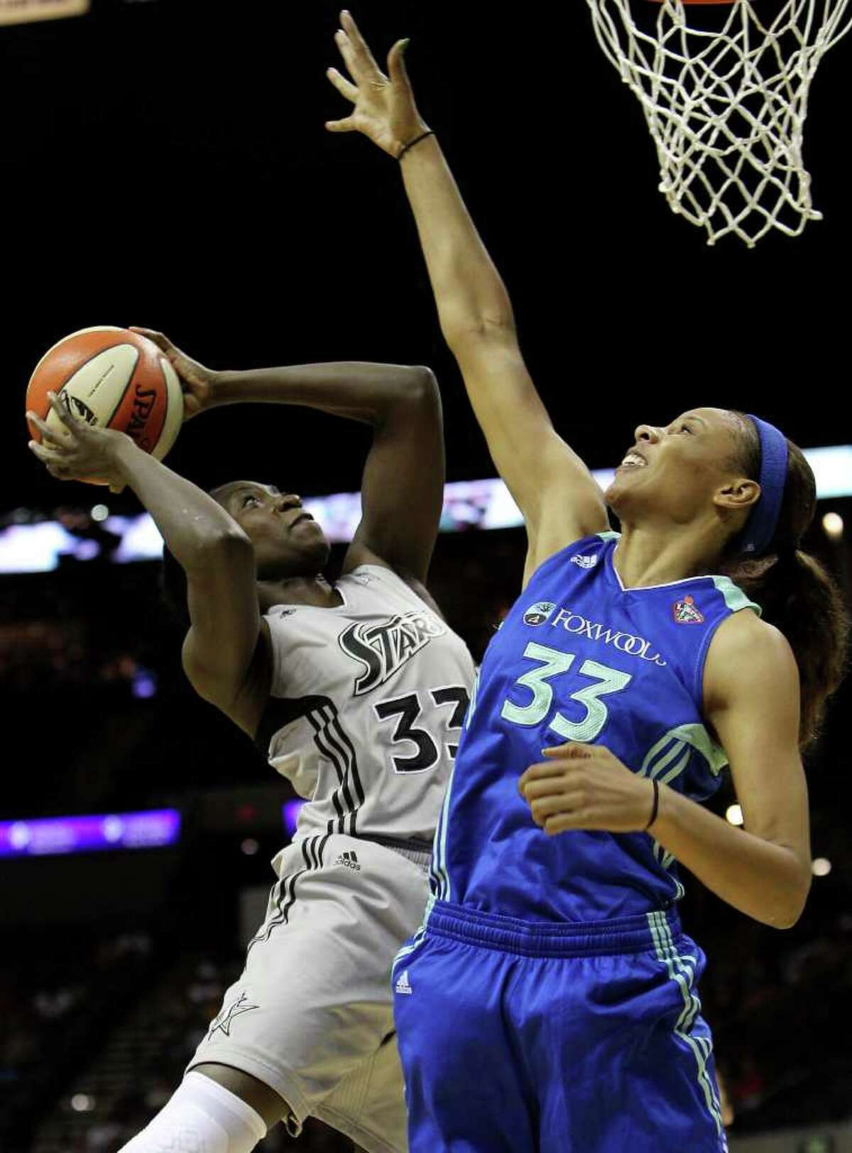 Silver Stars' Sophia Young (left) takes a shot against New York Liberty's Pienetter Pierson (right) in the first half at the AT&T Center on Friday, July 8, 2011. Kin Man Hui/kmhui@express-news.net