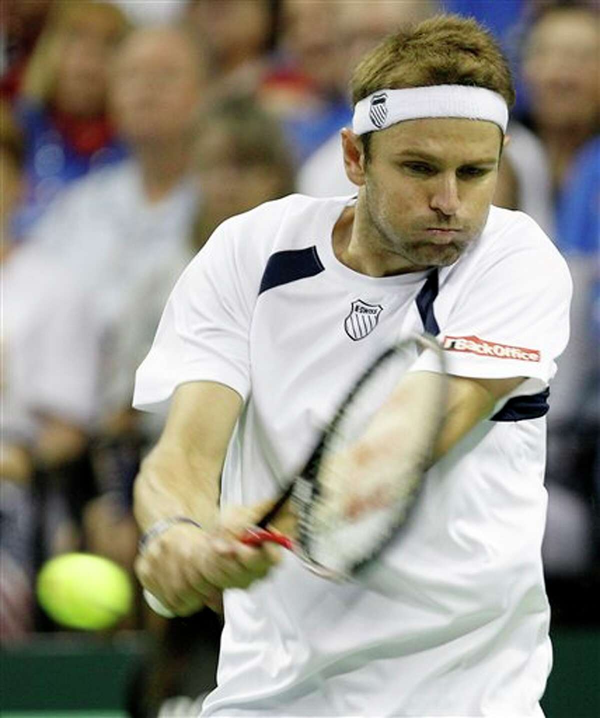 Mardy Fish of the U.S. returns the ball to Feliciano Lopez of Spain during a game in the Davis Cup quarterfinal tennis match, Friday, July 8, 2011, in Austin, Texas. (AP Photo/Eric Gay)