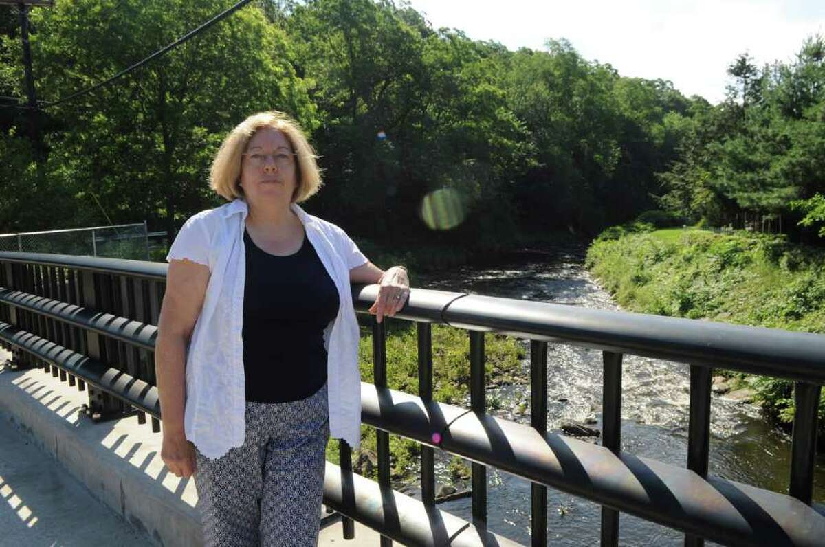 Denise Savageau, Greenwich conservation director, stands on the Comley Avenue Bridge where there is a stream gauge, on Wednesday, June 29, 2011. Savageau is concerned about recurring droughts in Greenwich.
