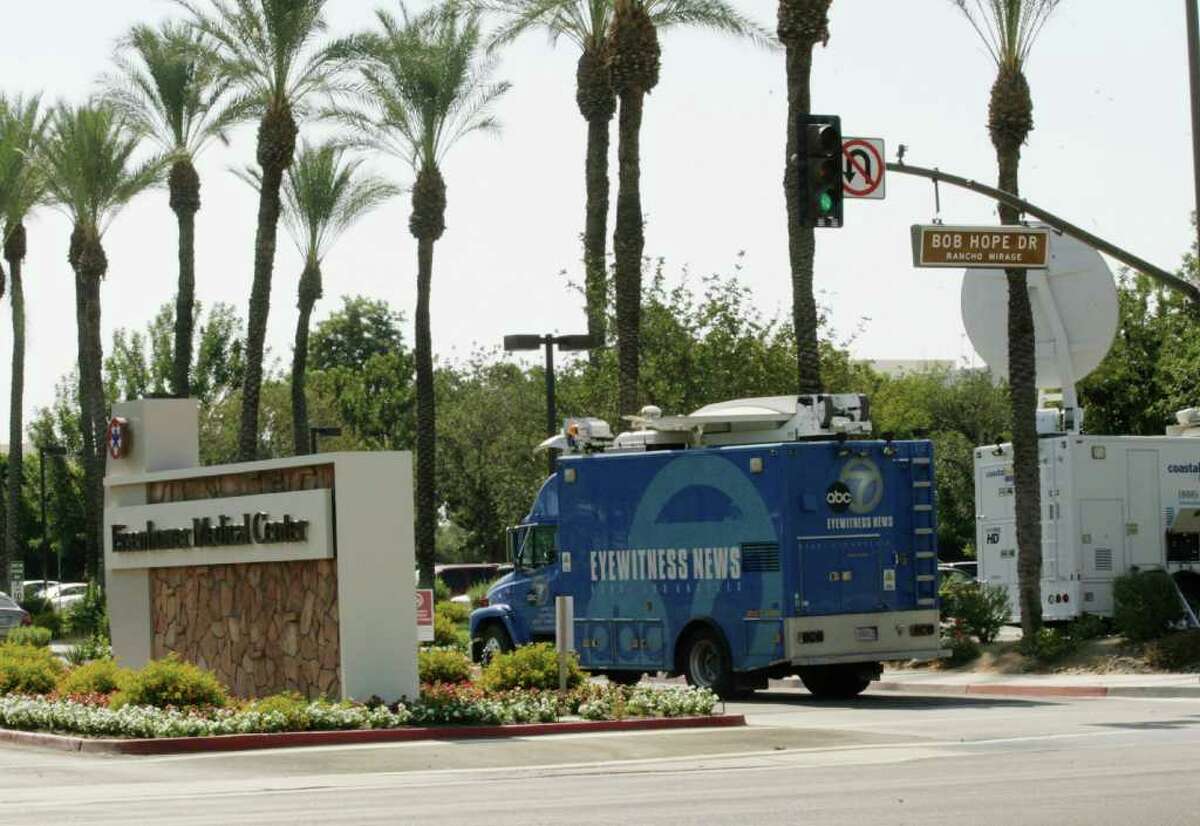 A news truck drives by the entrance to the Eisenhower Medical Center in Rancho Mirage, Calif., on Saturday, July 9, 2011. The former First Lady died at the hospital on Friday, July 8.(AP Photo/Francis Specker)