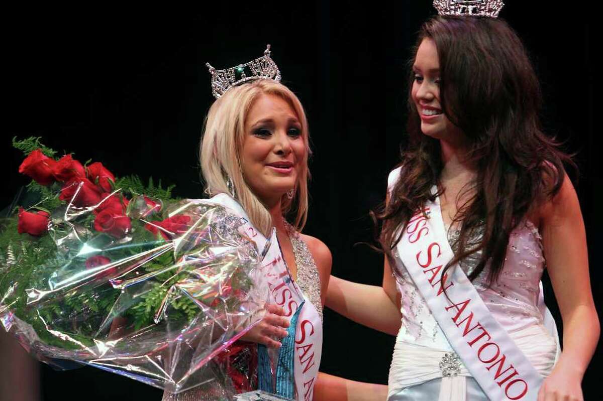 Michelle Spencer is crowned the new Miss San Antonio by outgoing Miss San Antonio Domonique Ramirez at the Charlene McCombs Empire Theatre on July 9, 2011.