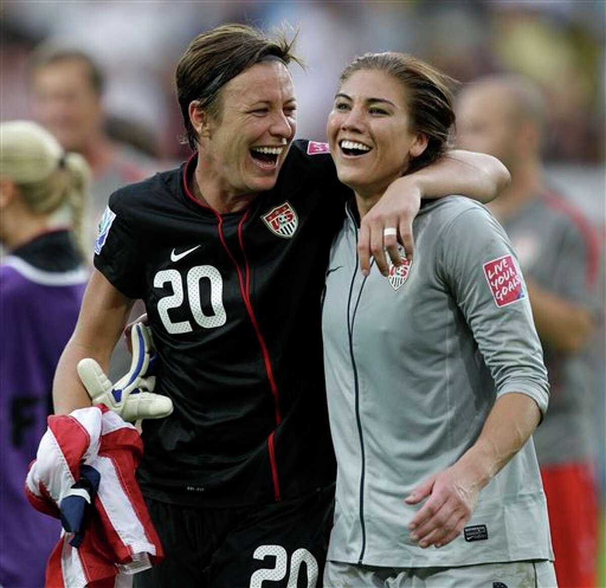 United States' Abby Wambach, left, and United States goalkeeper Hope Solo celebrate winning the the quarterfinal match between Brazil and the United States at the Women�s Soccer World Cup in Dresden, Germany, Sunday, July 10, 2011. (AP Photo/Marcio Jose Sanchez)
