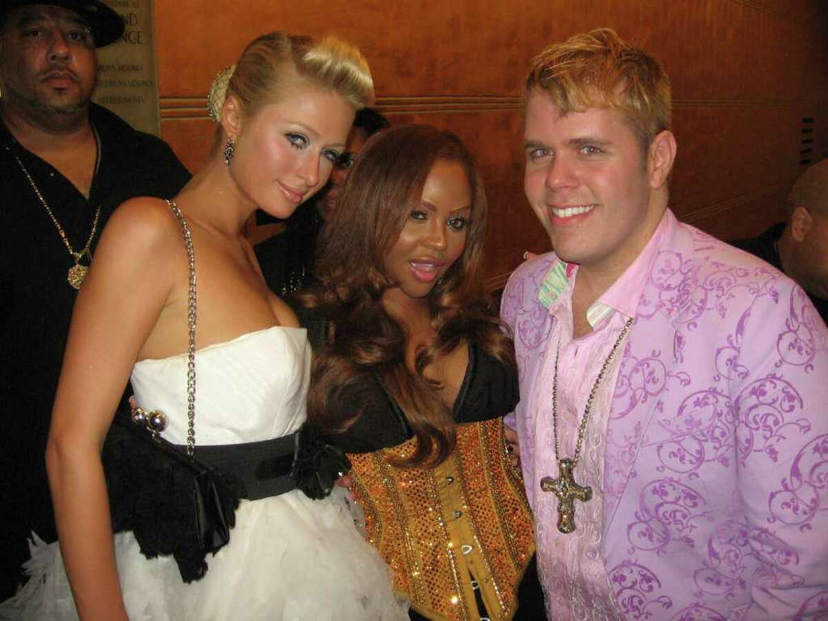 This photo provided by Perez Hilton, shows blogger Perez Hilton, right, with celebrities Paris Hilton, left, and Lil' Kim at the MTV Music Video Awards in New York in Aug. 2006. Perez Hilton, whose Web site has become a go-to source for juicy celebrity dish, says he knows his place in the bold-faced world. It's outside looking in.