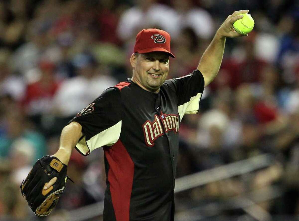 PHOENIX, AZ - JULY 10: Former MLB player Mark Grace throws the ball during the 2011 Taco Bell All-Star Legends & Celebrity Softball Game at Chase Field on July 10, 2011 in Phoenix, Arizona. (Photo by Jeff Gross/Getty Images)