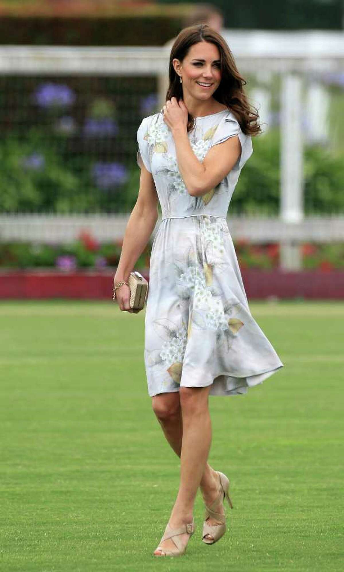 The Duchess presented her husband's winning team with a trophy at a charity polo match in Santa Barbara, California. She wore a hand painted Jenny Packham silk dress for the occasion.