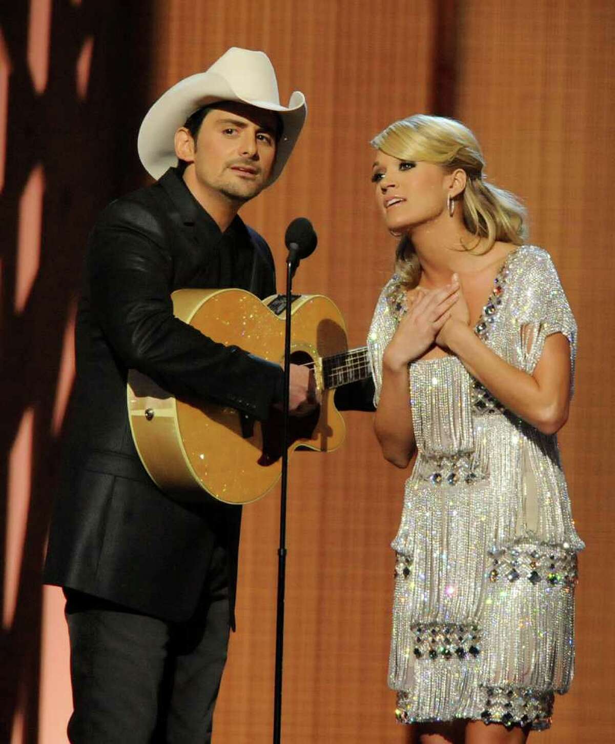 Carrie and Brad to host CMA Awards a 4th timeNASHVILLE, Tenn. (AP) -- Carrie Underwood and Brad Paisley will be back together again in November.They've been picked to host the Country Music Association Awards for a fourth straight year. The 45th annual awards will be aired live Nov. 9 from Nashville's Bridgestone Arena on ABC.Paisley is the reigning CMA entertainer of the year. Paisley and Underwood have won 19 CMA awards between them.As Paisley notes in a news release announcing their return, they've achieved a comic chemistry over the years with Underwood's class balancing "my non-class act. I'll try my best to not mess it up."The CMA Awards are the most-watched country awards show. More than 16 million viewers tuned in last year. [Brad Paisley and Carrie Underwood perform at the CMAs in Nashville on Nov. 11, 2009]