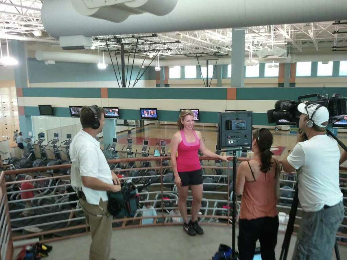 Cynthia Lee is filmed for an HGTV show at the site of her kickboxing class.