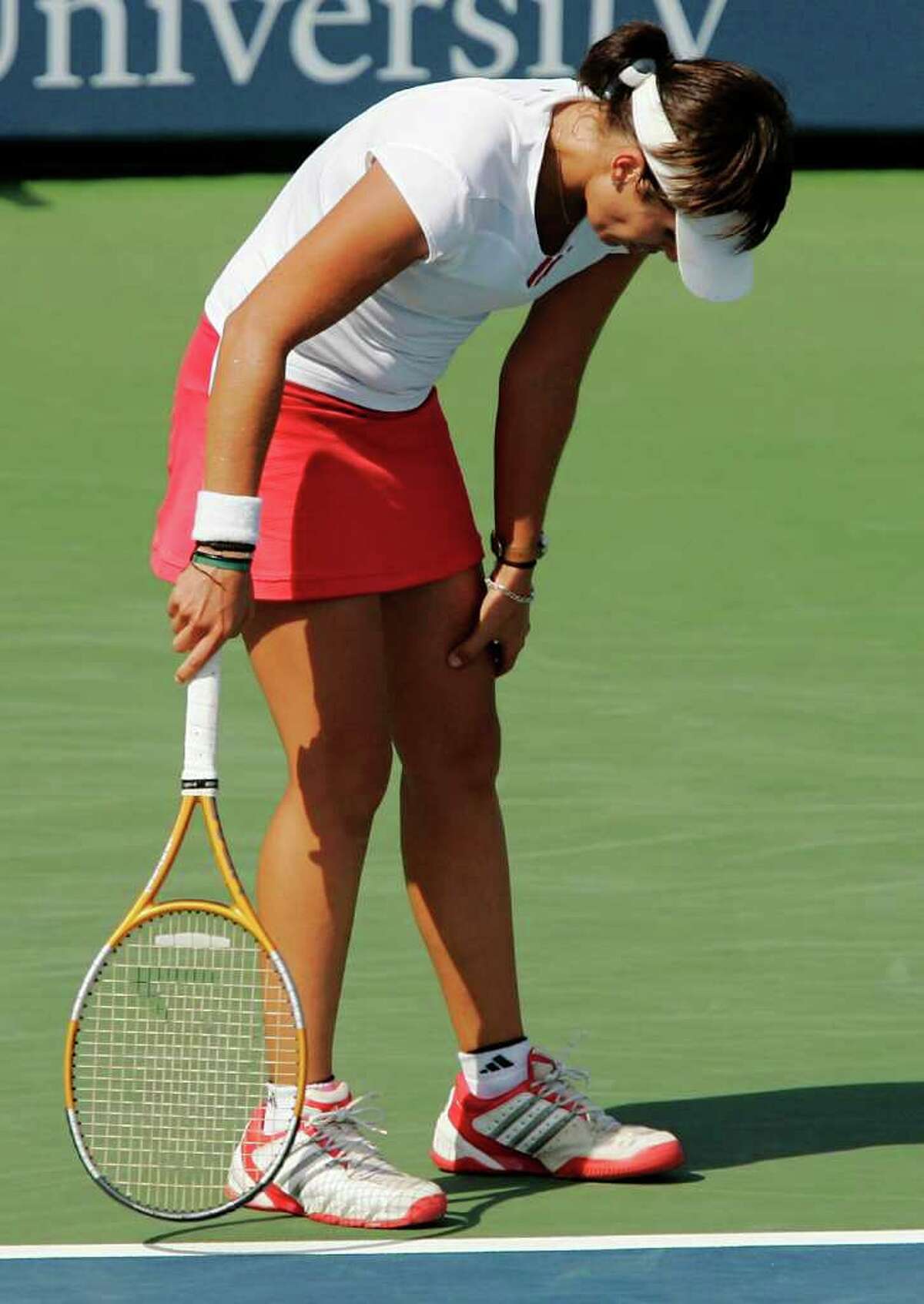 NEW HAVEN, CT - AUGUST 26: Anabel Medina Garrigues of Spain grabs her thigh after losing a point to Amelie Mauresmo of France during the Pilot Pen Tennis tournament on August 26, 2005 at the Connecticut Tennis Center at Yale in New Haven, Connecticut. Medina Garrigues was treated for cramps while Mauresmo went on to win 6-4, 7-6 (5), 6-2 to advance to the finals. (Photo by Brian Bahr/Getty Images)