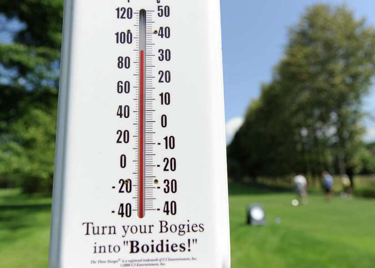 The temperature was above 90 degrees according to the thermometer at Griffith E. Harris Golf Course, Greenwich, during the Women's Town Golf Tournament Tuesday afternoon, July 12, 2011.