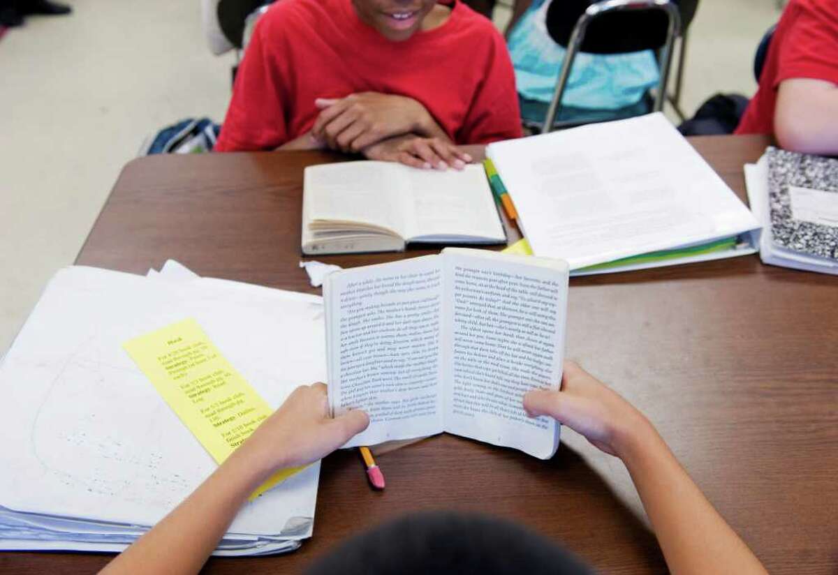 Seventh-graders at Turn of River Middle School participate in the school's book club in Stamford in April. More seventh-graders reached goal in the reading portion ot this year's Connecticut Mastery Tests than in 2010.