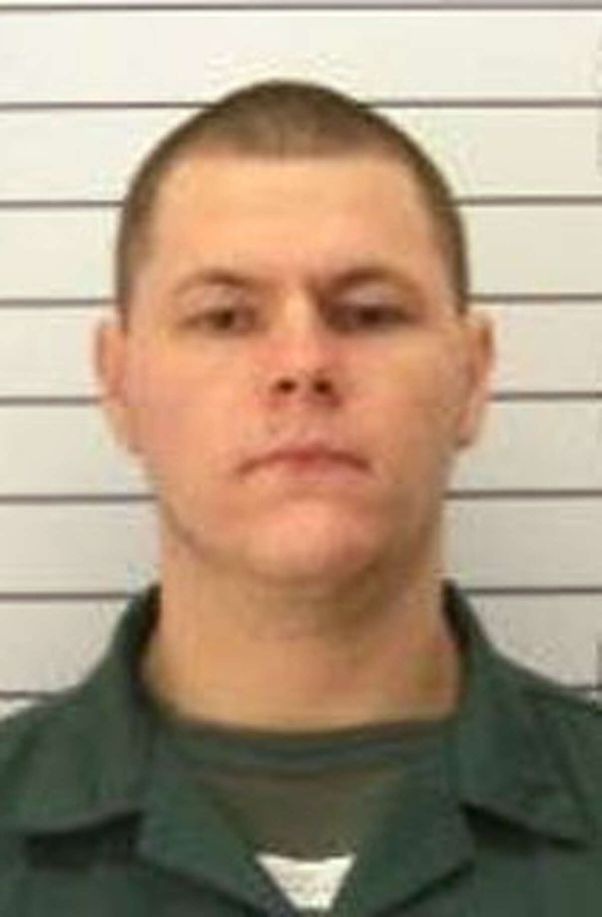 This undated photo from the New York State Department of Corrections shows Matthew Slocum, who is now charged with three counts of second-degree murder and two counts of arson after a fire in White Creek Wednesday. (Associated Press/State Department of Corrections and Community Supervision)