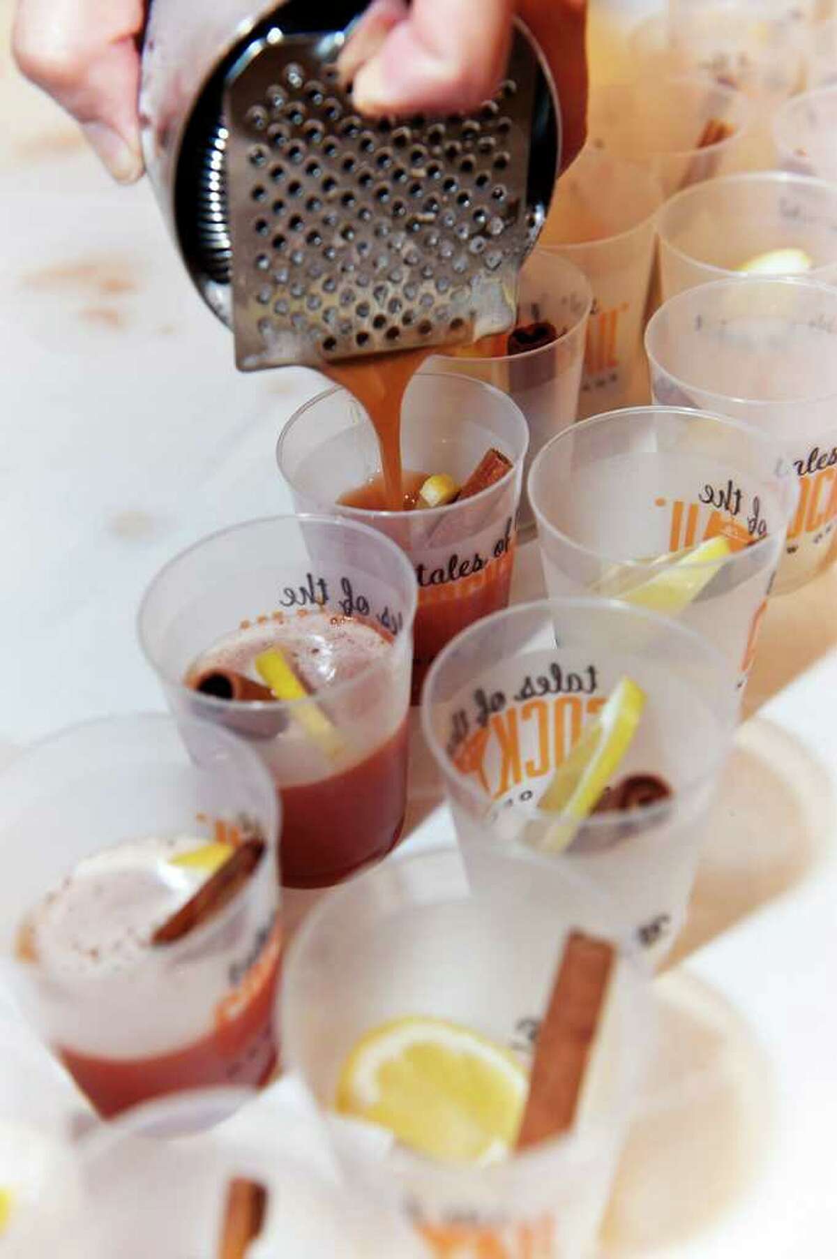 Pouring cocktail samples at Tales of the Cocktail, New Orleans. Credit: Brian Huff