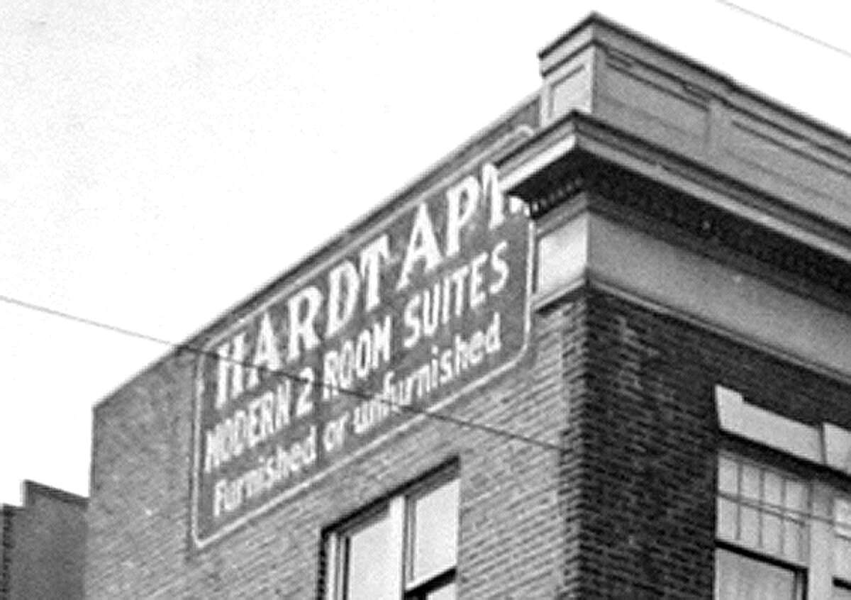 A sign for the Hardt Apartments in spring 1937. The building is located at 4135 University Way Northeast.