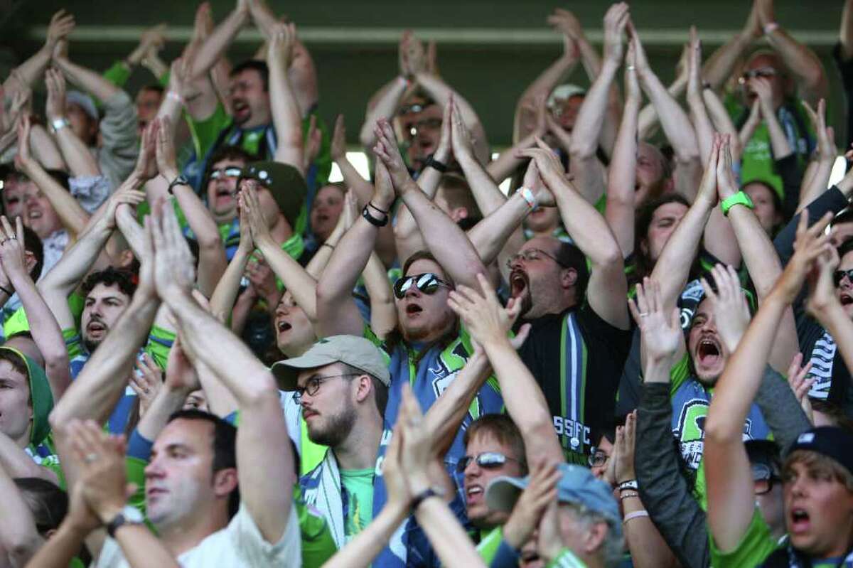 Seattle Sounders fans cheer their team against the Los Angeles Galaxy during the first half of a U.S. Open Cup quarterfinal match at Starfire Sports Complex in Tukwila on Wednesday, July 13, 2011. The Sounders defeated the Galaxy 3-1.
