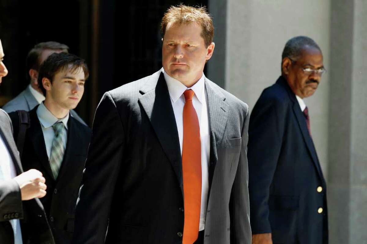 Former Major League baseball pitcher Roger Clemens leaves federal court in Washington, Thursday, July 14, 2011, after the judge declared a mistrial in his perjury trial after prosecutors showed jurors evidence that the judge had ruled out of bounds. (AP Photo/Alex Brandon)