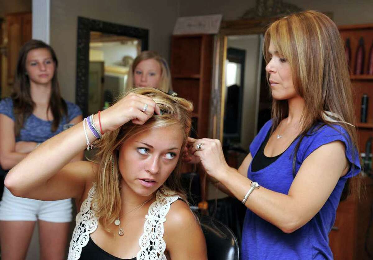 Newtown salon says feathers are flying off the shelves