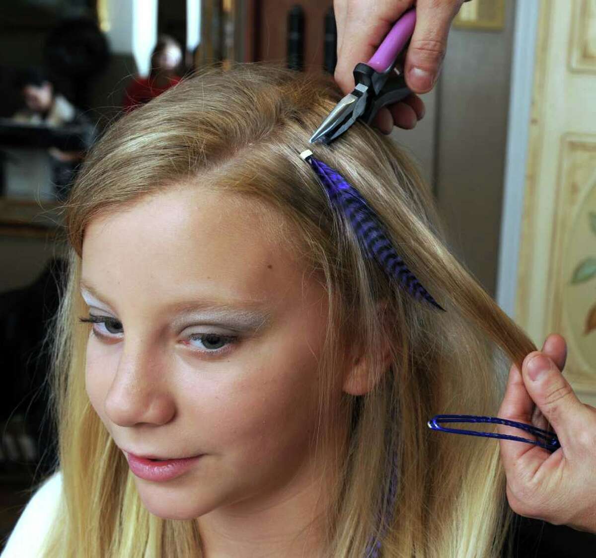 Newtown salon says feathers are flying off the shelves