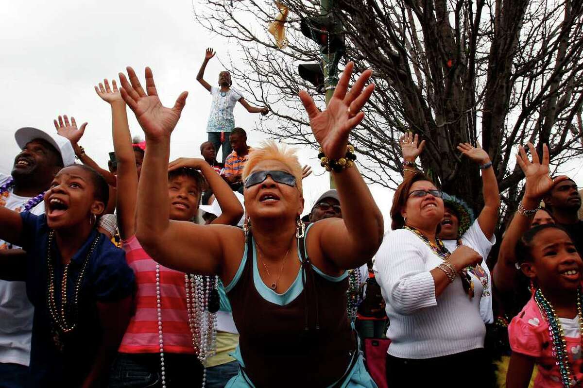 Spectators beg for throws during the Zulu Parade on Mardi Gras day, Tuesday, Feb. 5 2008. The parade returned to its original route for the first time since Hurricane Katrina. (Nicole Fruge/San Antonio Express News)