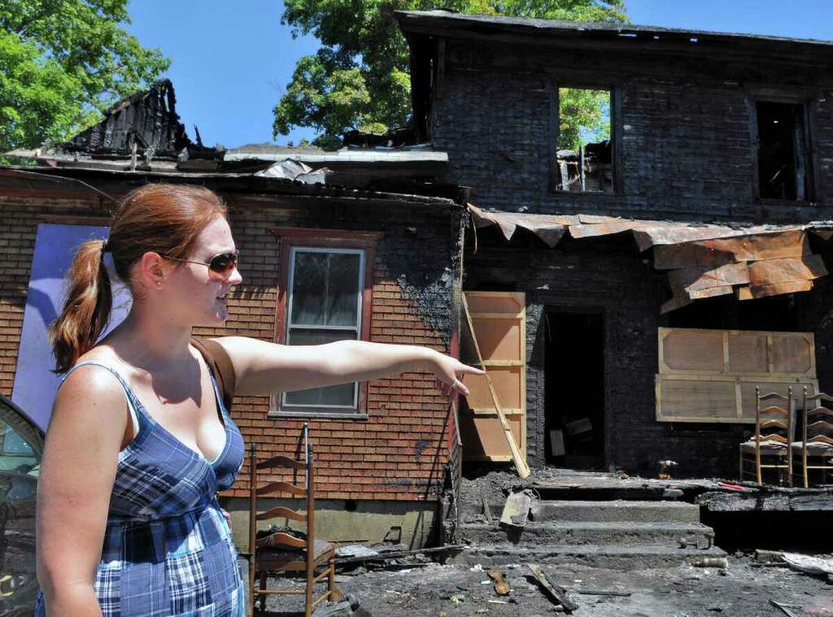 Mac-Haydn Theater costume intern Laura Krevs of Seattle describes the fire at the theater's guest house in Chatham Thursday July 14, 2011. All ten theater crew members inside at the time of the fire escaped unharmed.(John Carl D'Annibale / Times Union)