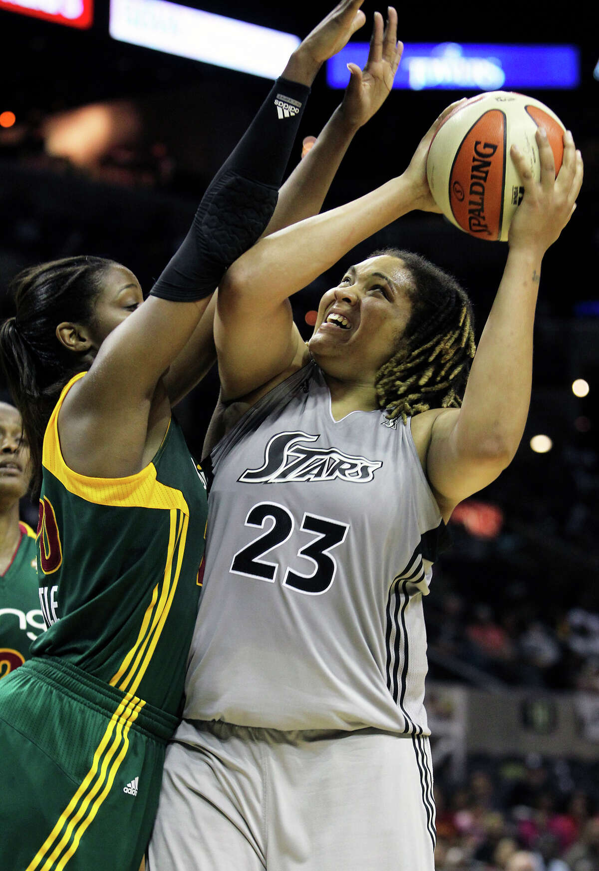 Stars forward Danielle Adams gets tough points in the final minutes against Camille Little as the San Antonio Silver Stars play the Seattle Storm at the AT&T Center on July 14, 2011. Tom Reel/Staff