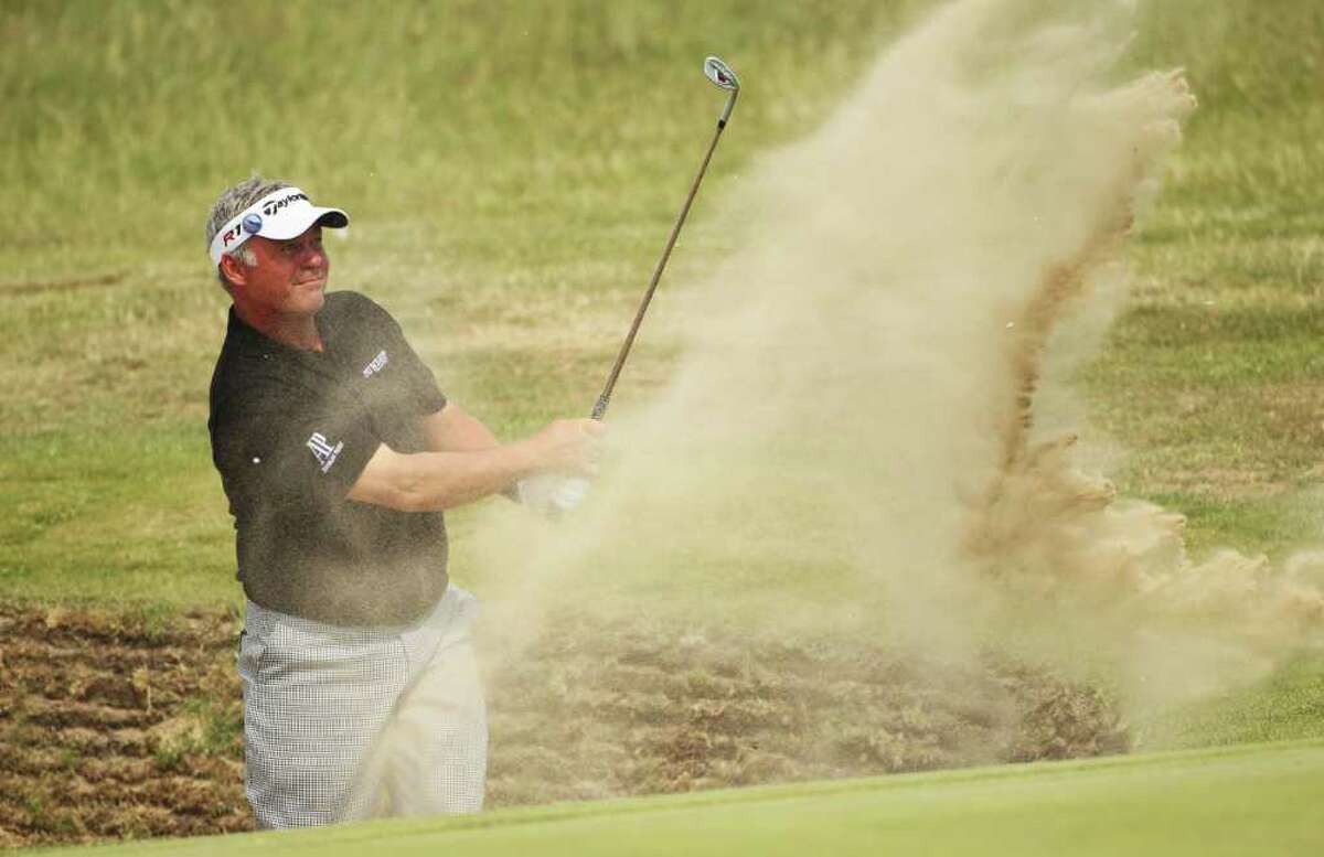 SANDWICH, ENGLAND - JULY 15: Darren Clarke of Northern Ireland hits from a bunker on the 16th hole during the second round of The 140th Open Championship at Royal St George's on July 15, 2011 in Sandwich, England. (Photo by Andrew Redington/Getty Images)