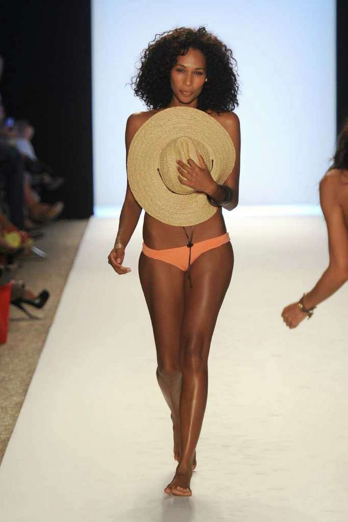 A model walks the runway at the L*SPACE BY MONICA WISE show during Mercedes-Benz Fashion Week Swim at The Raleigh in Miami Beach, Fla., on Friday, July 15, 2011.
