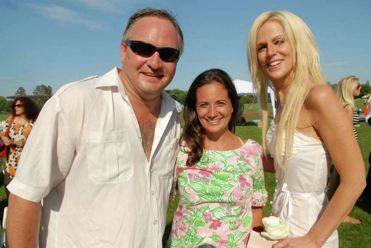 Jen Danzi, center, organizer of the Victory Cup at Greenwich Polo Club, with "White House party crashers" Tareq and Michaela Salahi. (John Ferris Robben/For Greenwich Time)