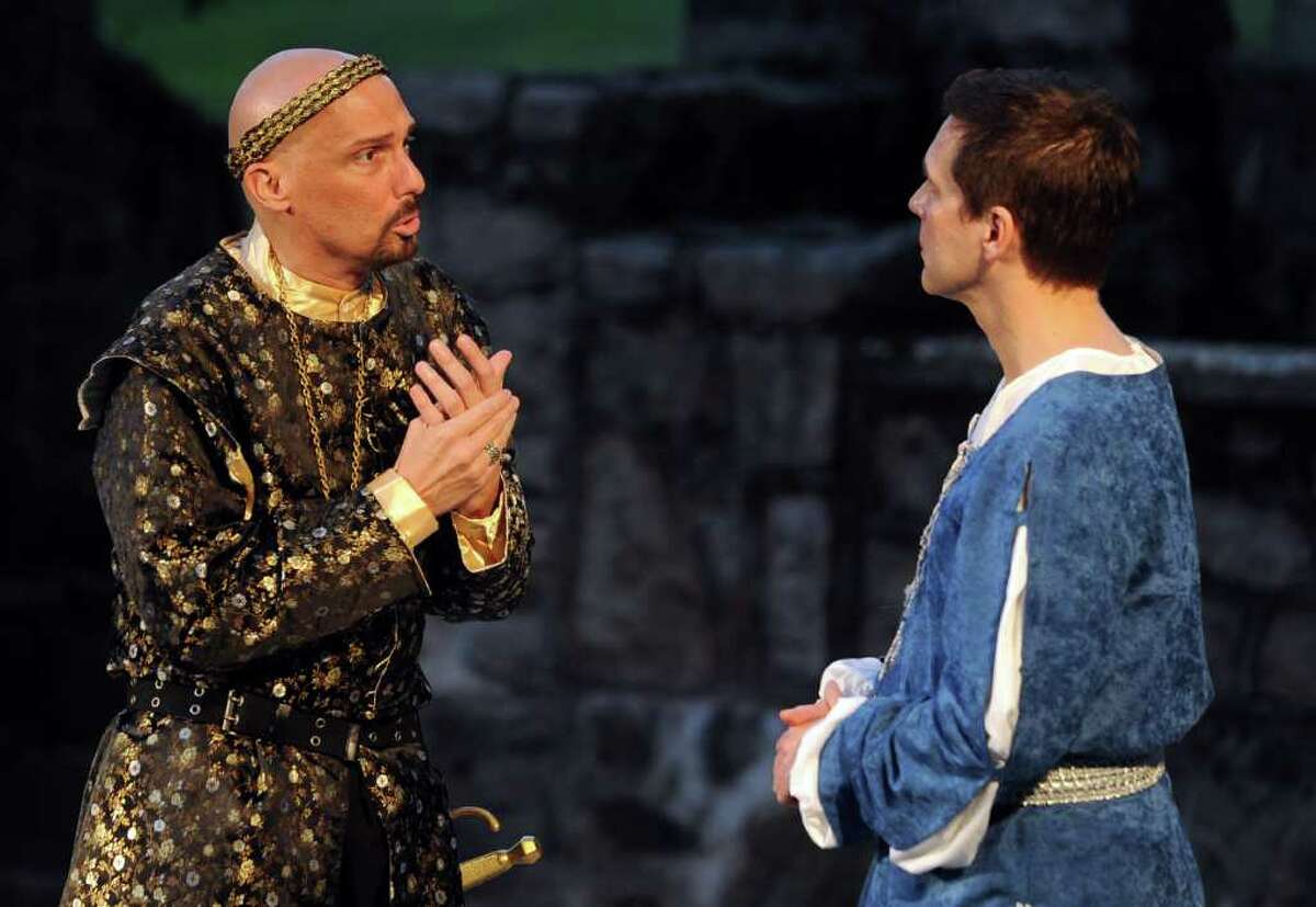 Mark Frattaroli as Leontes, left, and Miles Everett as Camillo, right, perform during The Players at Putney Gardens' production of The Winter's Tale at Boothe Memorial Park in Stratford on Saturday, July 16, 2011.