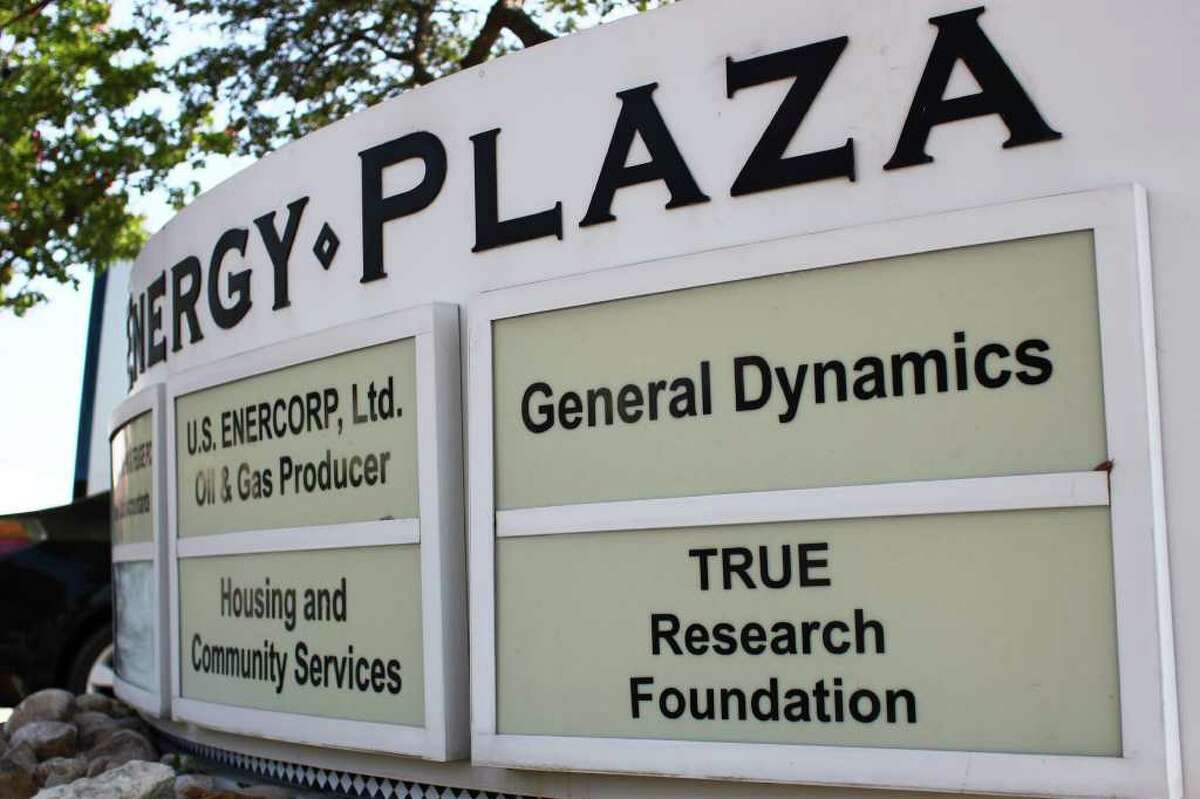 A sign still informs visitors to an office building at Energy Plaza that it houses the headquarters of the T.R.U.E. Research Foundation. Suite 705, where the headquarters were located, now is empty.