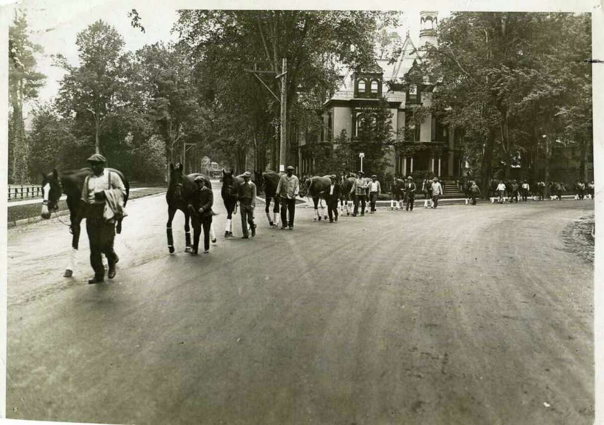 Horses are led up Circular Street (past the Batcheller Mansion) to the track on July 15, 1934. There were no horse vans back then ... all the horses came up from New York via train and then walked up to the track. (The Knickerbocker Press)