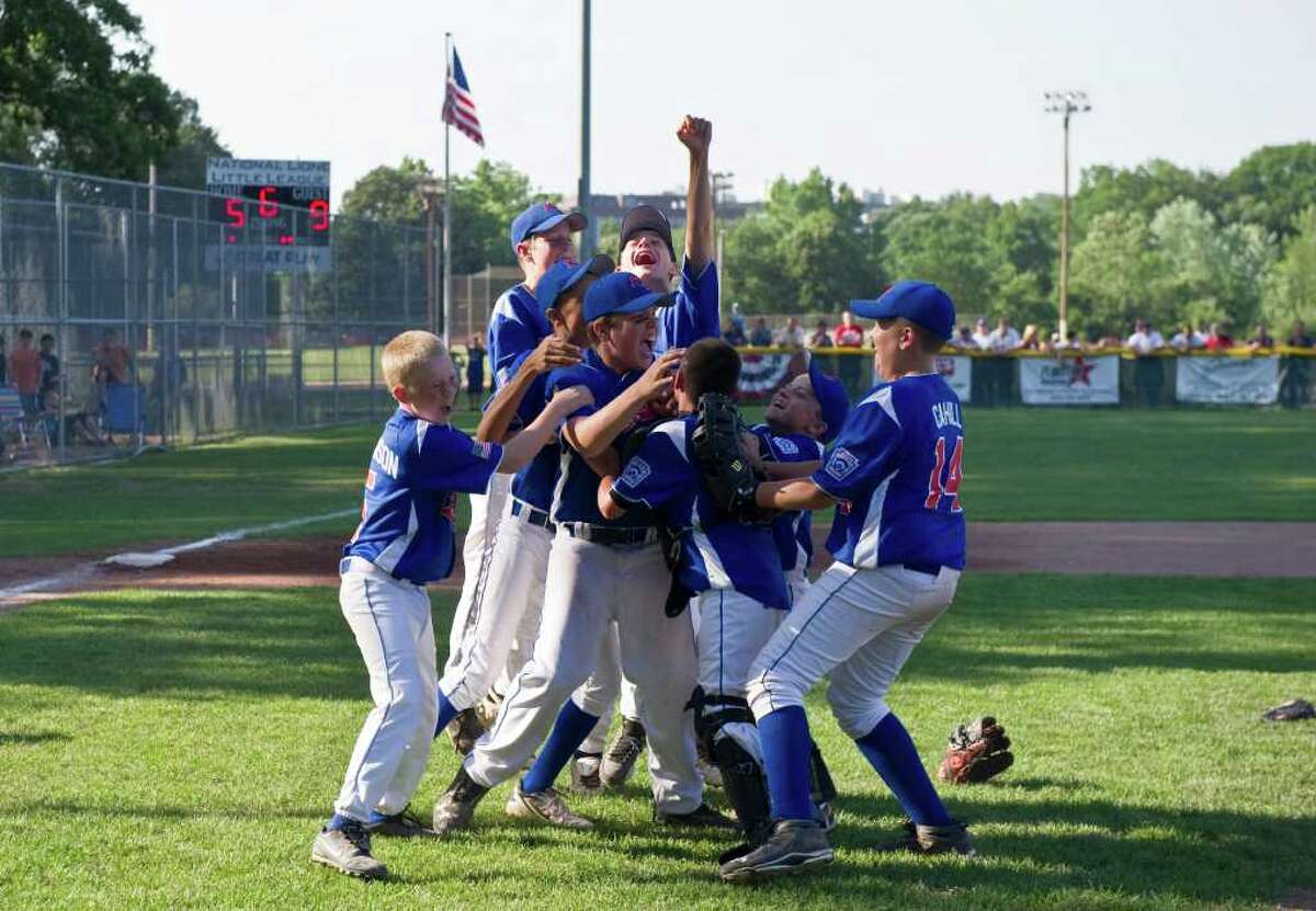 North Stamford celebrates after defeating National Lione 9-5 in the Little League District 1 Championship at Scalzi Park in Stamford, Conn., July 17, 2011.