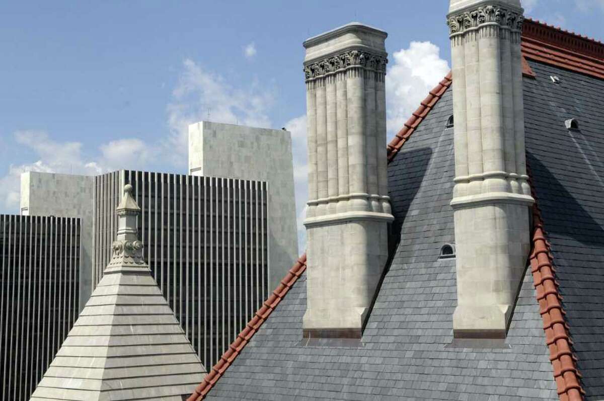 A view of the capitol roof with two of the agency buildings in the background as work continues on the Capitol restoration project on Wednesday morning, July 13, 2011 in Albany. (Paul Buckowski / Times Union)