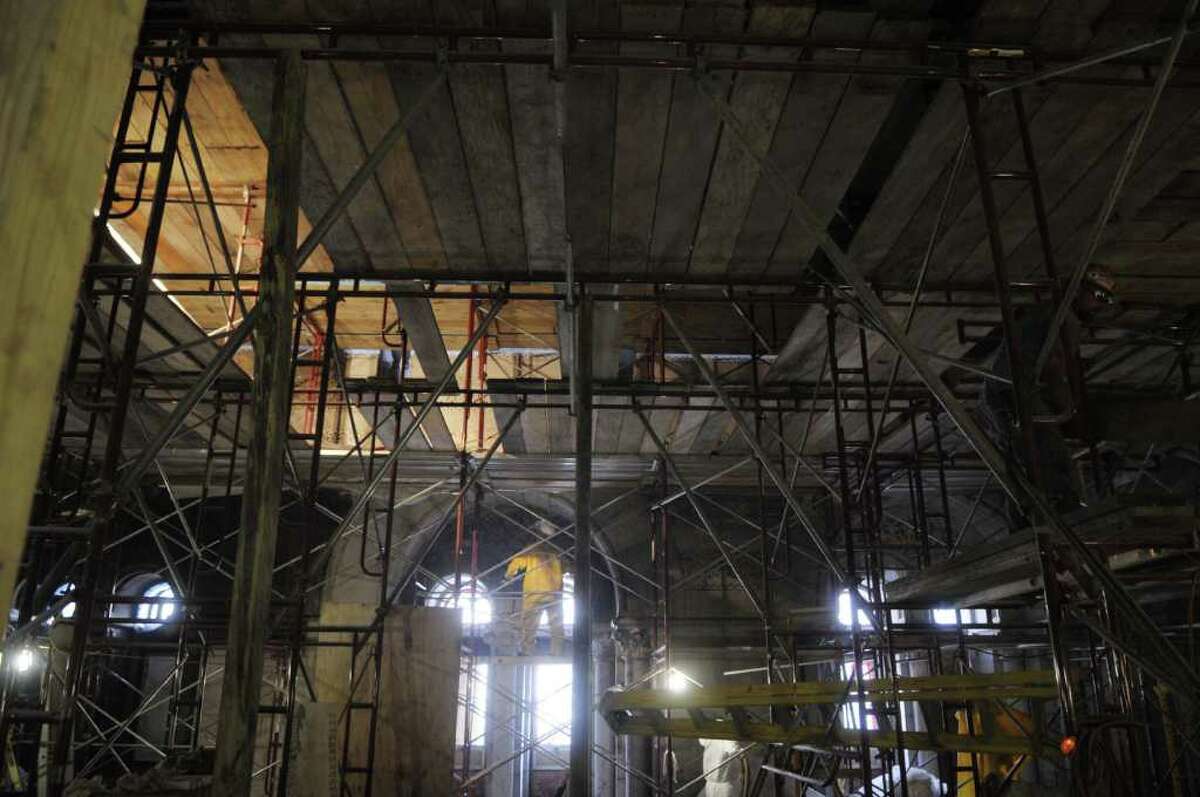 A worker cleans the stonework in the tower hall room of the capitol as work continues on the Capitol restoration project on Wednesday morning, July 13, 2011 in Albany. (Paul Buckowski / Times Union)