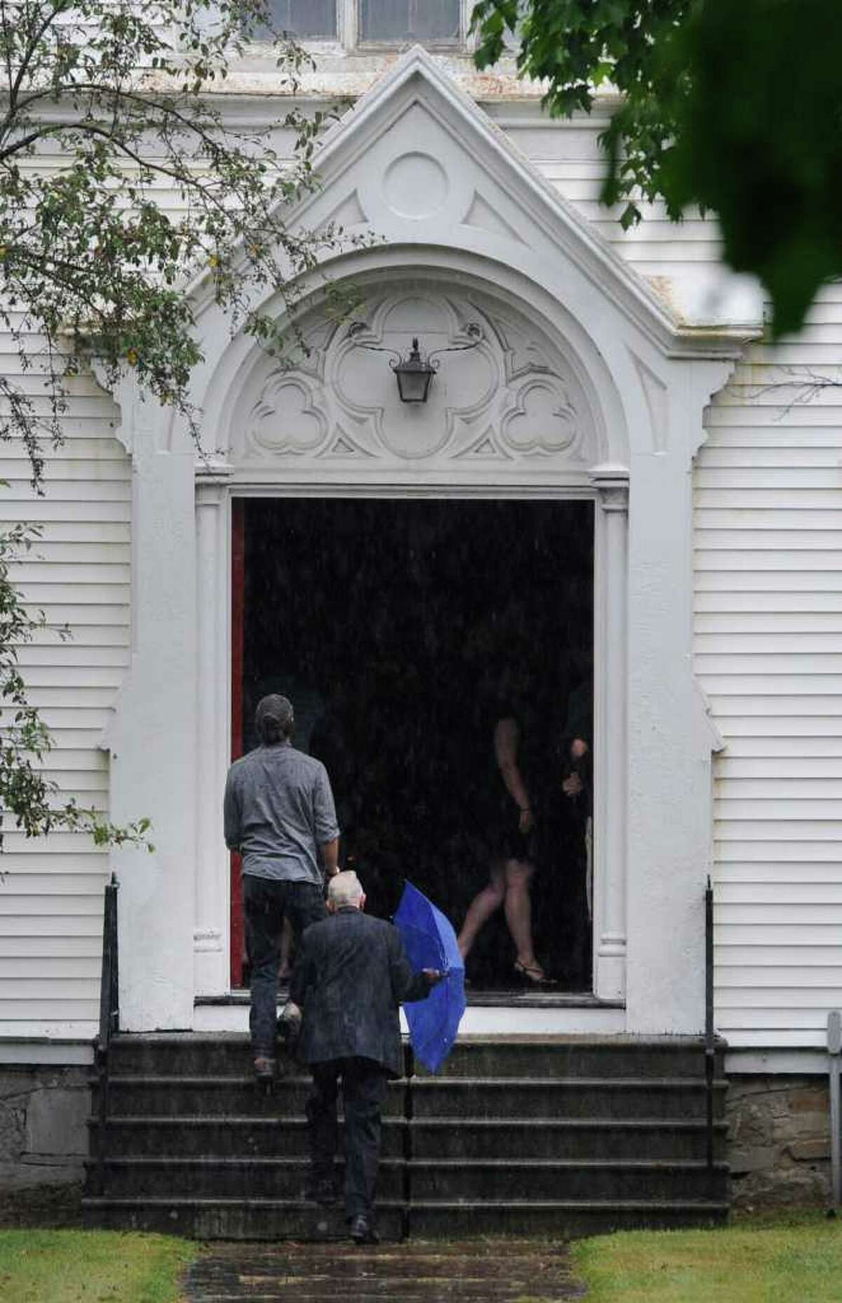 Mourners enter the Cambridge United Presbyterian Church in Cambridge, N.Y. July 18, 2011, to attend the funeral of Dan Harrington, Deputy Town Highway Superintendent for the Town of White Creek, his wife Lisa Harrington and step son Josh O'Brien who were shot to death and their bodies burned allegedly by their son Mathew Slocum. (Skip Dickstein / Times Union)