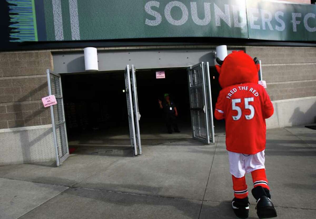 The Manchester United mascot walks into CenturyLink Field.