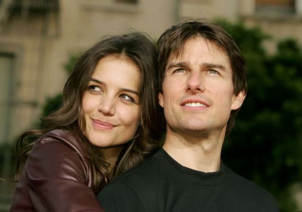 Tom Cruise and Katie Holmes arrive for a Los Angeles screening of War of the Worlds, June 27, 2005.