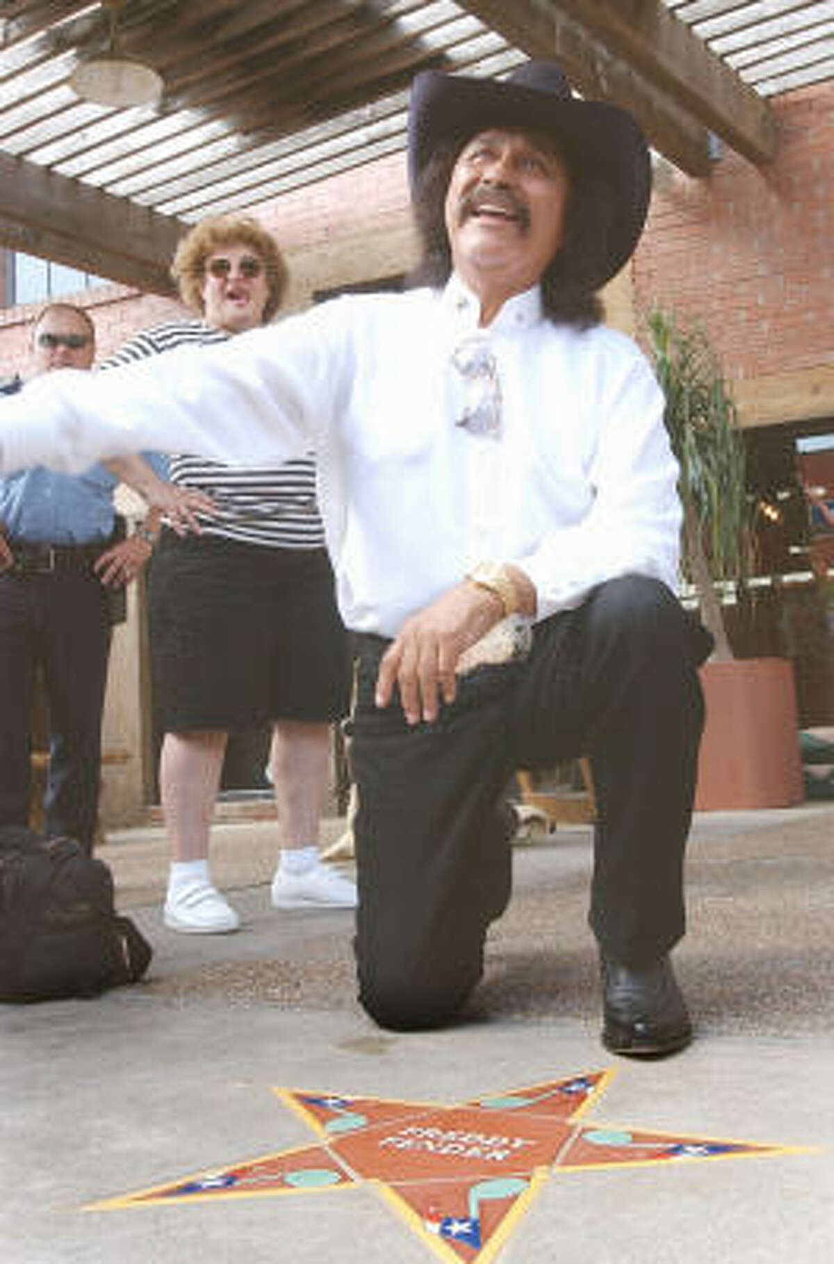 Freddy Fender is shown with his star on the South Texas Music Walk of Fame in Corpus Christi in 2005.