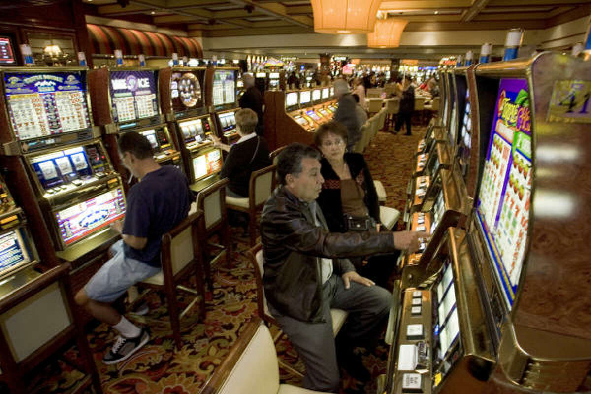 Joe and Mary Lopez, of Arcadia, Calif., play the slot machines on the main casino floor at the Golden Nugget.