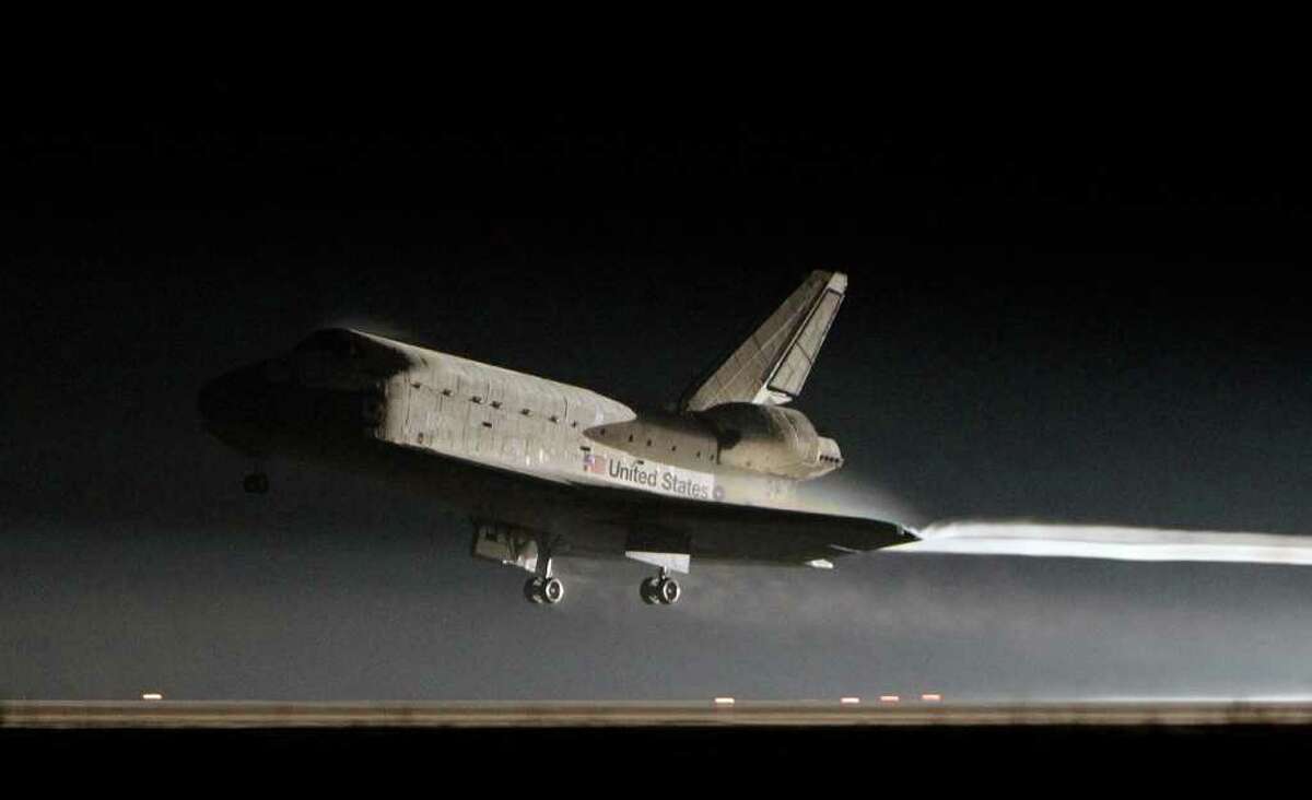 Space shuttle Atlantis lands at the Kennedy Space Center in Cape Canaveral, Fla., Thursday, July 21, 2011. The landing of Atlantis brings the space shuttle program to an end. (AP Photo/John Raoux)