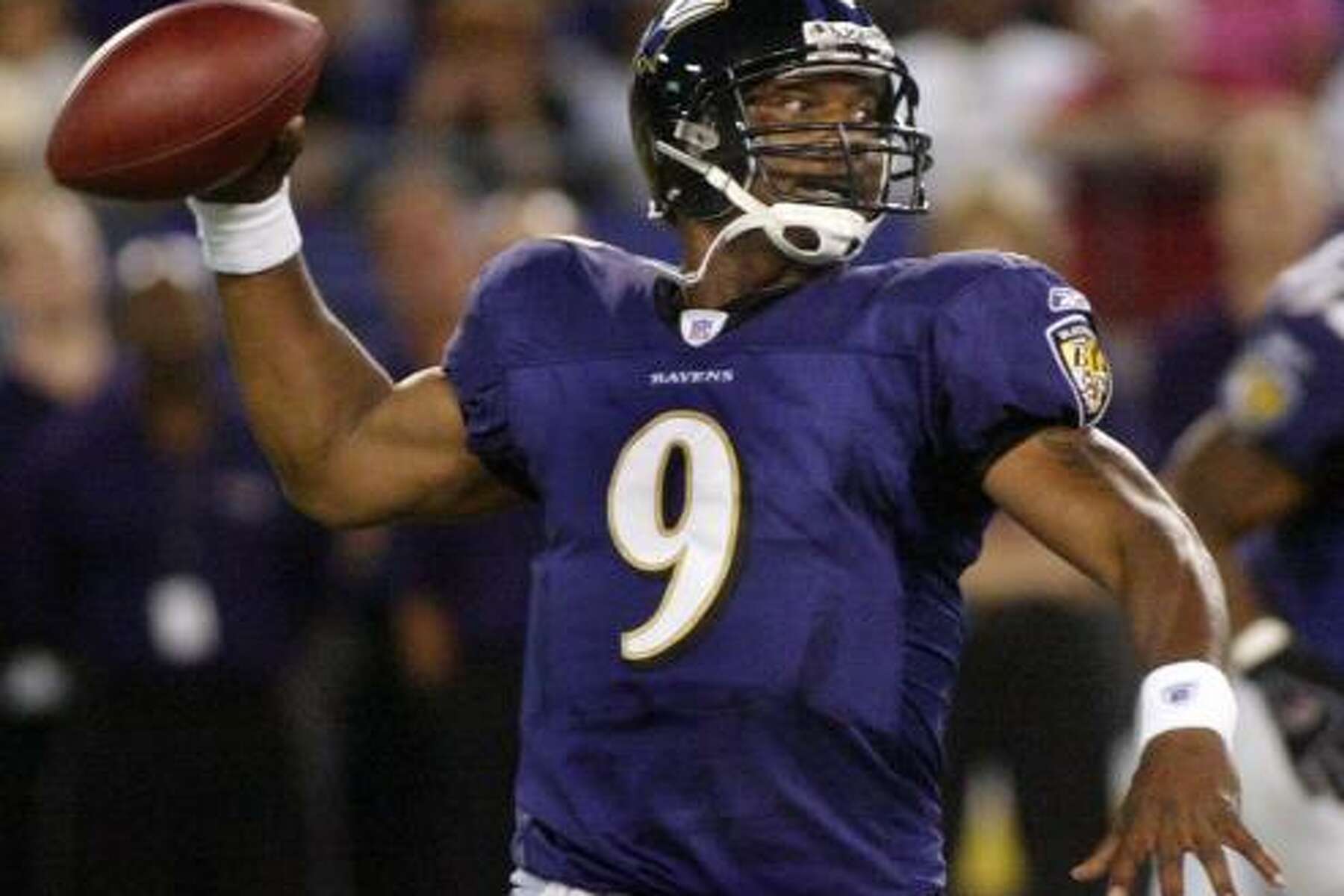 Quarterback Steve McNair of the Baltimore Ravens looks for a