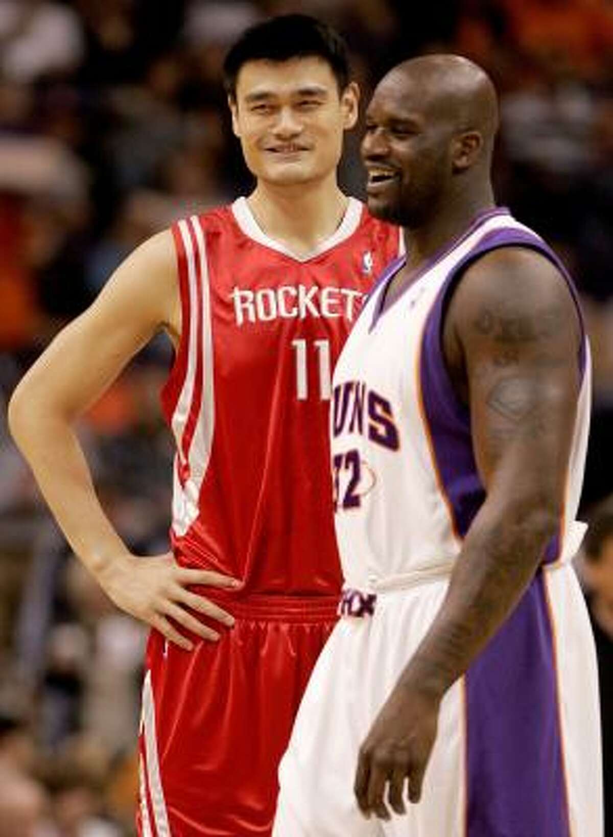 Rockets center Yao Ming (11) is looking forward to a "straight-up" matchup against Phoenix Suns center Shaquille O'Neal (right) in tonight's game at Toyota Center.
