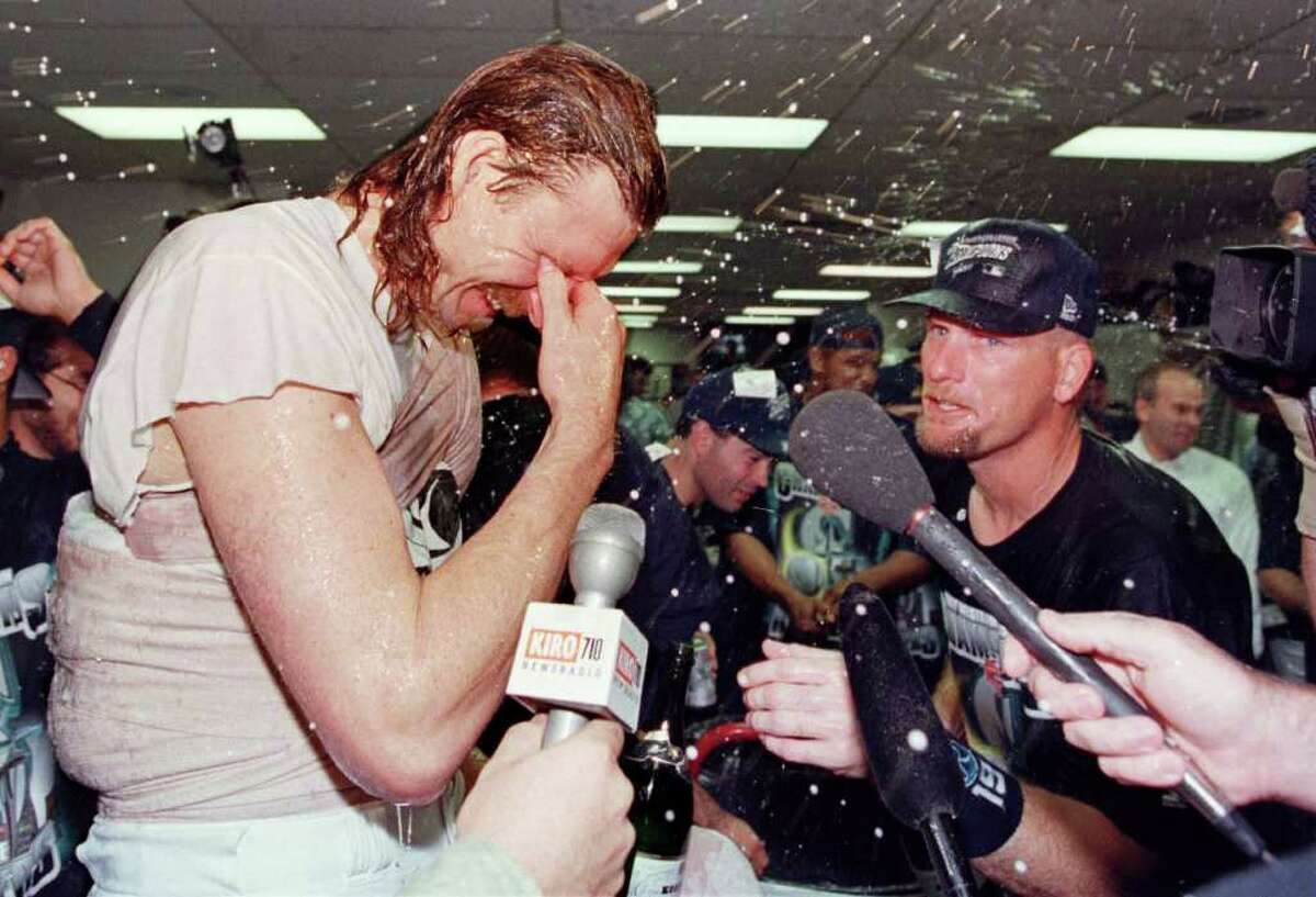 If Seattle fans have learned anything from rooting for mediocrity for so long, it's how to appreciate small victories. And 1997 was full of them. No Seattle team won a title, but looking back, 1997 was an all-around great year for local sports. So as we wallow in the doldrums of another lost Mariners season, it can't hurt to look back to happier days. One of those days was Sept. 23, 1997, when the Mariners clinched the American League West with a 4-3 win over the California Angels. Randy Johnson, left, struck out 11 in eight innings to get the win. Jay Buhner, right, added a three-run homer.
