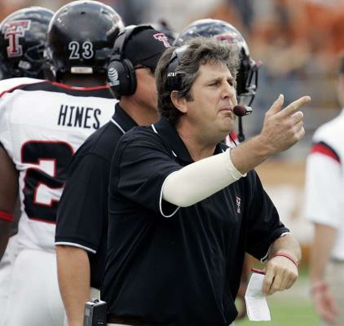 Surprising to some, coach Mike Leach, center, and his Texas Tech Red Raiders have a shot at the national title.