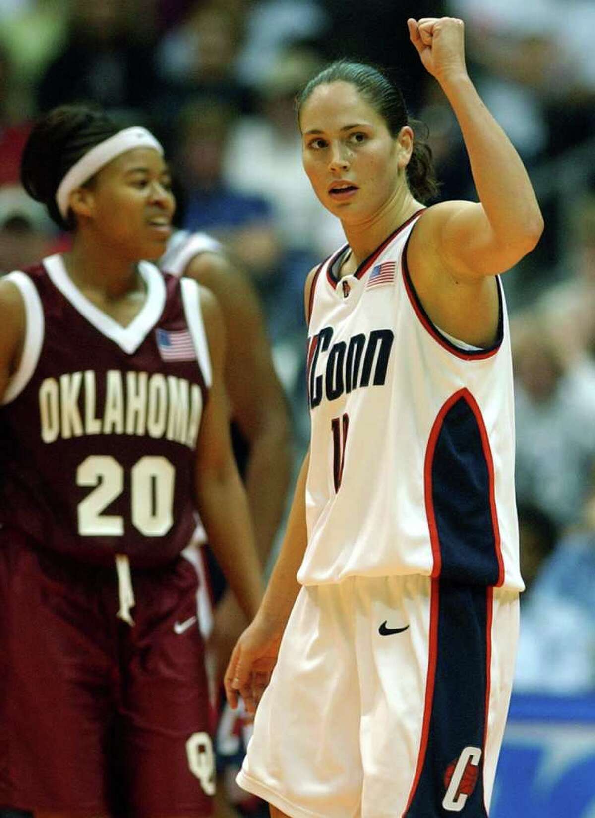 Pictured: UConn's Sue Bird raises her fist after a good play as OU LaNeishea Caulfield looks on during the second half at the Alamodome in San Antonio on Sunday, Mar. 31, 2002. (Kin Man Hui/staff)