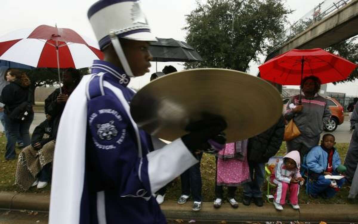 Residents braved afternoon showers to watch band members from Wheatley High School march down Allen Parkway on Monday during the MLK Parade Foundation's 14th Annual MLK Grande Parade.