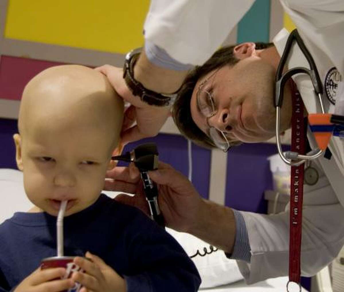 Dr. Maurizio Ghisoli, monitoring 2-year-old Nathan Stovall, is one of about 10,400 oncologists practicing in the U.S. Ghisoli is a first-year fellow in pediatric oncology.