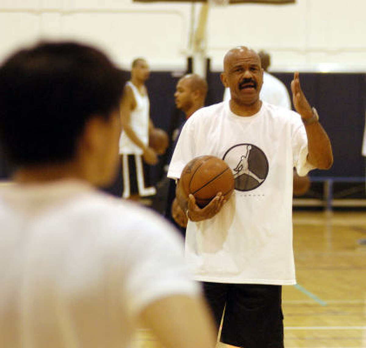 Former Cavaliers coach John Lucas, seen here in 2003, pulls no punches when stressing basics at his summer camp.