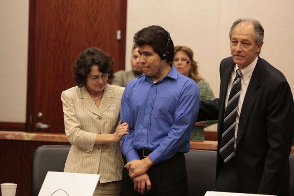 Juan Leonardo Quintero, center, shown in court on Tuesday, had just one response after hearing the jury's decision: "I'm sorry."