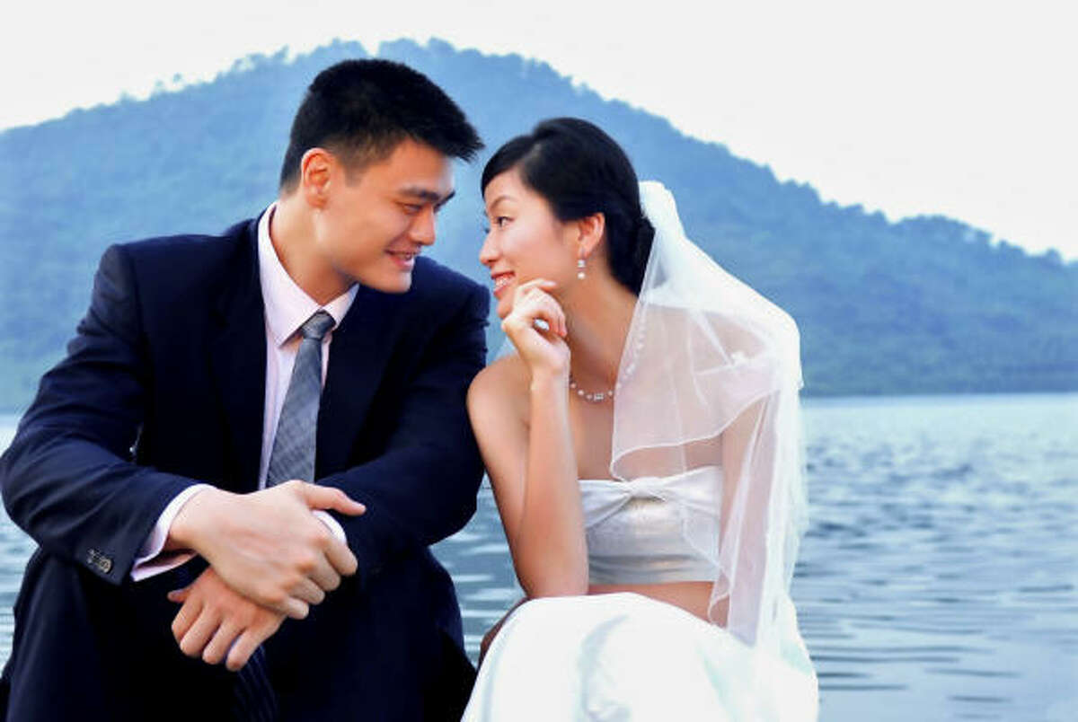 Yao Ming and Ye Li share a picture perfect moment in this wedding photo taken in Linan, China.